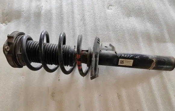 Volkswagen Caddy Front shock absorber with coil spring