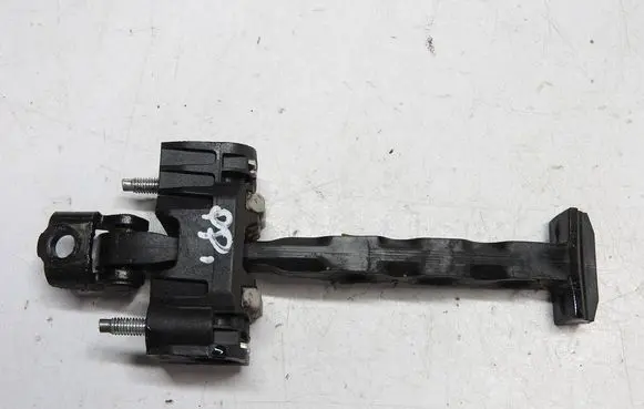 Front door check strap stopper