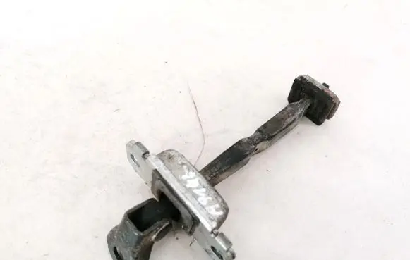 Front door check strap stopper