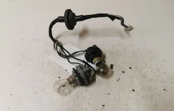 Mazda 323 Tail light bulb cover holder