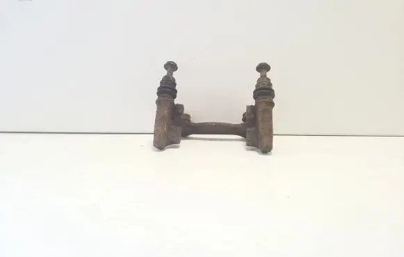 Volkswagen PASSAT B5 Brake caliper pad carrier rear 