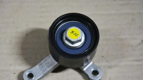 Volkswagen Golf VII Timing belt tensioner pulley 05E109187