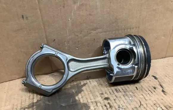 Piston with connecting rod