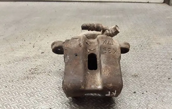Suzuki Grand Vitara I Front brake caliper 