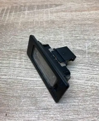 Volkswagen PASSAT B6 Number plate light 8T0943021