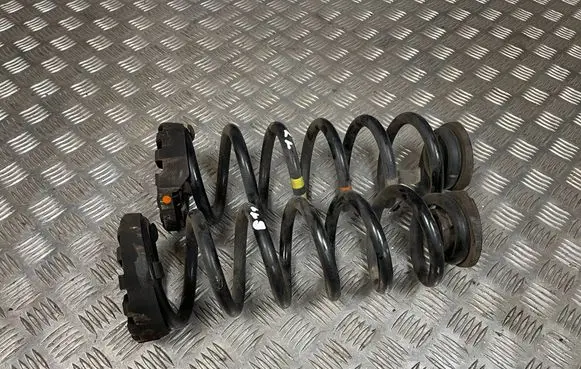 Jaguar XE Rear coil spring rubber mount GX733C357AA