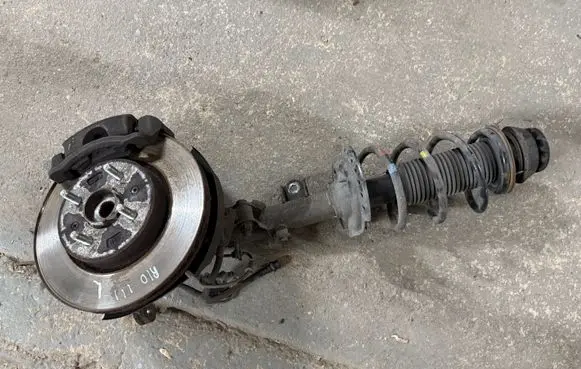 Front wheel hub spindle knuckle