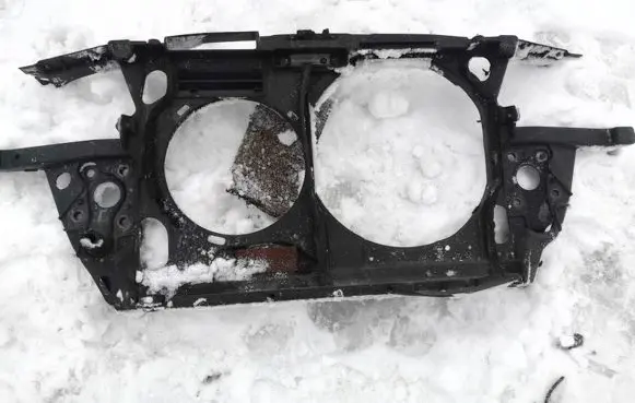 Radiator support slam panel