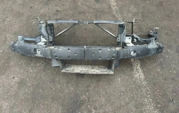 Radiator support slam panel