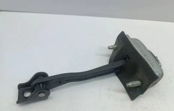 Front door check strap stopper