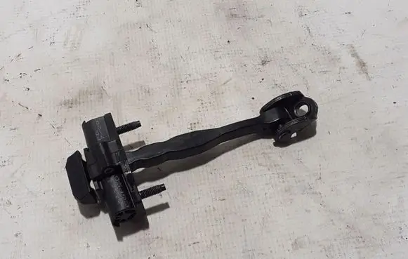 Front door check strap stopper