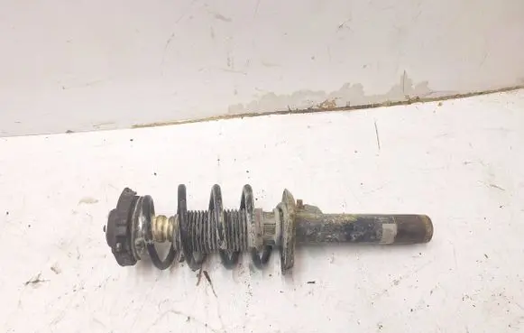 Volkswagen Caddy Front shock absorber with coil spring