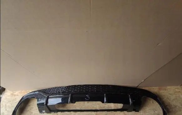 Rear bumper trim bar molding