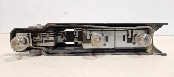 Tail light bulb cover holder