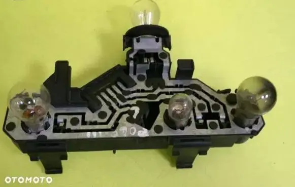Tail light bulb cover holder