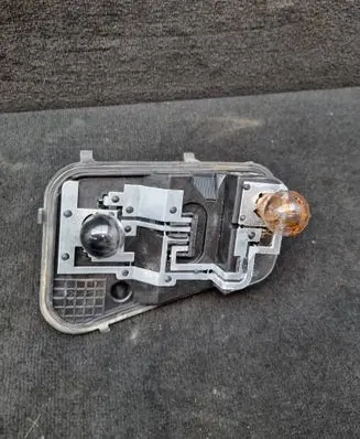 Volkswagen Touareg I Tail light bulb cover holder 7L6945258