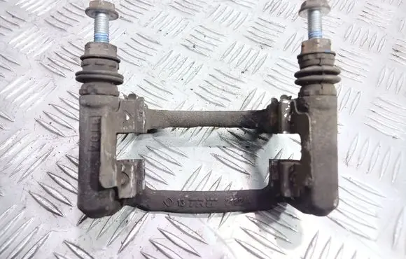 Mini One - Cooper Coupe R56 Brake caliper pad carrier rear 