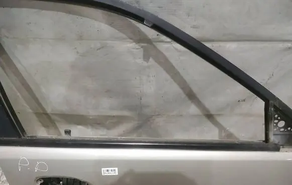 Mazda 323 Front door glass trim molding 