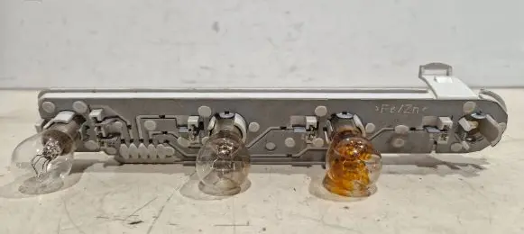 Tail light bulb cover holder
