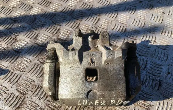 Nissan Juke I F15 Front brake caliper
