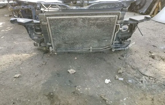 Radiator support slam panel