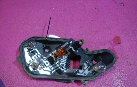 Tail light bulb cover holder
