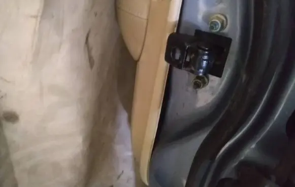 Jaguar XF Rear door check strap stopper