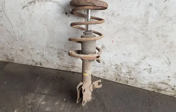 Nissan Almera Tino Front shock absorber with coil spring