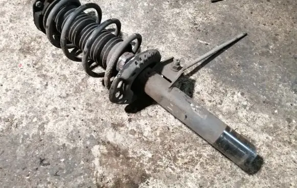 Volkswagen Golf Plus Front shock absorber with coil spring 1K0413031BE