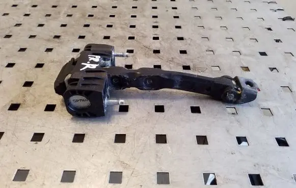 Front door check strap stopper