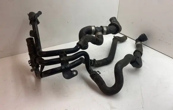 Volkswagen Golf VII Engine coolant pipe/hose 04L121064AF