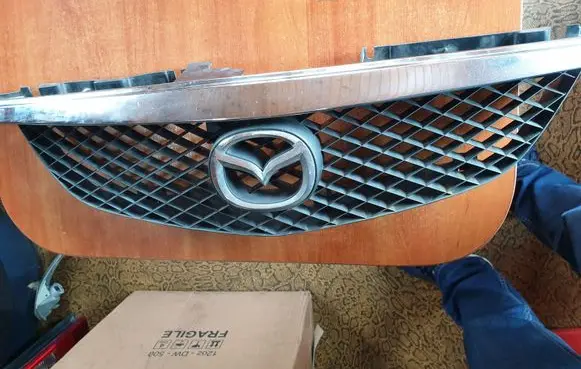 Mazda Premacy Front bumper upper radiator grill C100507412