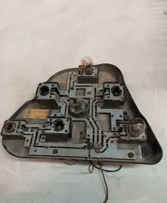 Tail light bulb cover holder