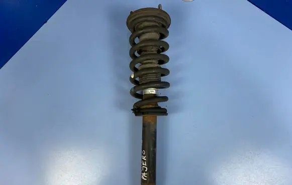 Mitsubishi Pajero Front shock absorber with coil spring MR554292 MR554260