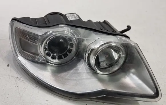 Volkswagen Touareg I Headlight/headlamp 7L6941032A 1LL24703204