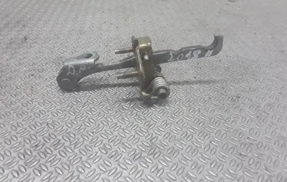 Front door check strap stopper