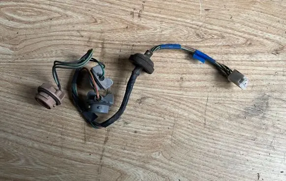 Mazda 323 F Tail light bulb cover holder