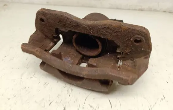 Mazda 323 F Front brake caliper