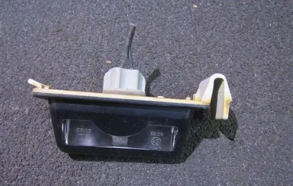 Mazda 323 Number plate light 8245