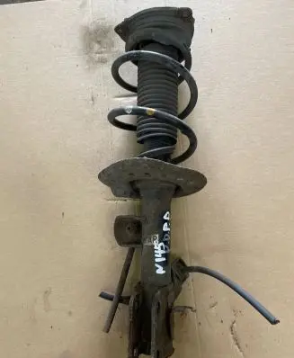 Nissan Juke I F15 Front shock absorber with coil spring