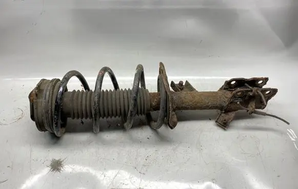 Nissan X-Trail T31 Front shock absorber with coil spring