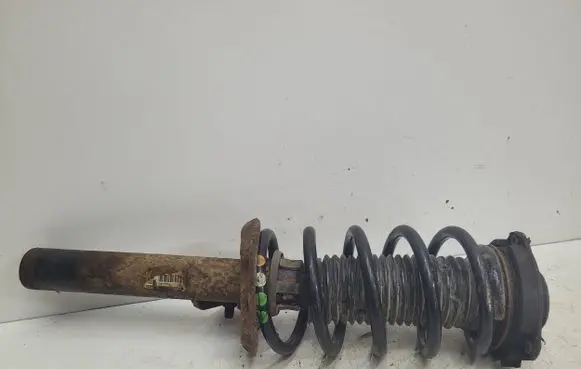 Volkswagen Caddy Front shock absorber with coil spring