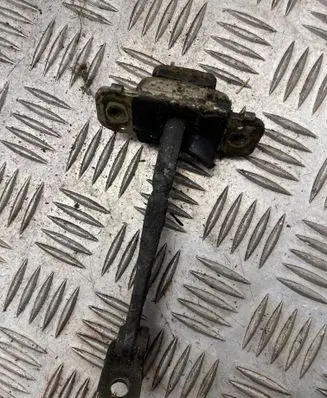 Front door check strap stopper