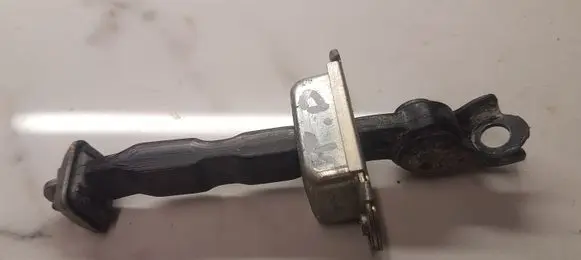 Nissan X-Trail T30 Front door check strap stopper