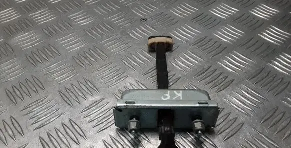 Front door check strap stopper