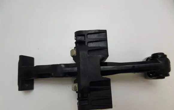 Front door check strap stopper