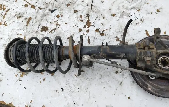 Peugeot 208 I Front shock absorber with coil spring 