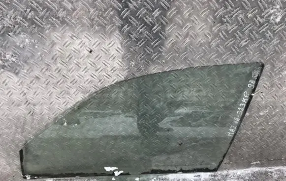 Mazda 323 Front door window glass four-door