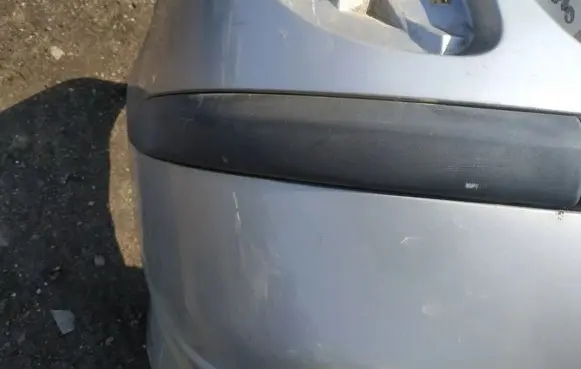 Rear bumper trim bar molding
