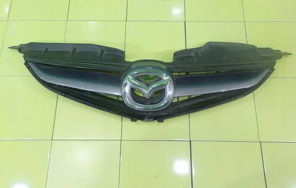Mazda 5 Front bumper upper radiator grill K3006 UP105